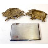 A Polo lighter and cigarette case and two brass pig ashtrays