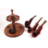 A teak pipe stand with three individual stands and four pipes