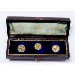 A set of three early 19th century engraved gold plated studs - boxed