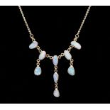 A silver necklace set with opal drops