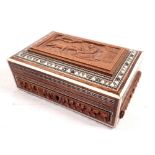 An Indian box carved woman feeding deer within inlaid border, 15cm wide