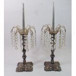 A Victorian pair of silver plated on copper candlesticks with later gilt crystal lustres, 28cm tall
