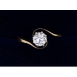 An 18 carat gold crossover set diamond ring, size K to L approx 1/2 carat or slightly less