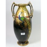 A Thomas Forrester Art Nouveau vase decorated peacocks, signed Dean, handles a/f, 44cm tall