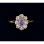 A 9 carat gold amethyst and paste costume ring, size N