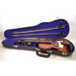 A 19th century full size violin after Joseph Guarnerius, with 14" two piece back and two bows ,