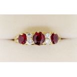 An 18 carat gold ruby and diamond ring, size Q