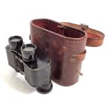 A pair of 19th century small field glasses in leather case