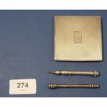 A silver compact London 1945 engraved 'MET' a silver pencil and a white metal one