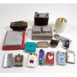 A box of various vintage lighters including Kincraft Deluxe combination lighter case and a novelty