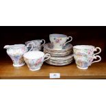 An Aynsley floral chintz set of five tea cups, five saucers, six tea plates and jug