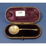 A silver gilt sifter spoon with Shakespeare terminal by George Unite, Birmingham 1881, cased