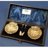 A pair of silver shell form salts and spoons - cased, Birmingham 1897