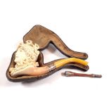 A 19th century Meerschaum pipe in form of a ladies head, cased and a cigarette holder