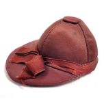 A silk jockey hat pin cushion, 7cm