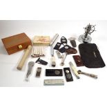 A collection of smoking paraphernalia including a wooden box of Meccarillos cheroots, Henri