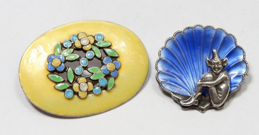 A silver and enamel shell and pixie brooch and a yellow silver and enamel floral brooch, by