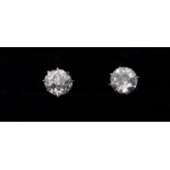 A pair of platinum set diamond stud earrings - approx 1ct total, for pierced ears