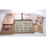 A box of cigarette cards including Wills Military Motors 1916 framed, Players etc. and a set of