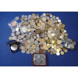 A quantity of world coins and tokens numerous, some silver content, coins include examples: