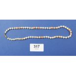A pearl and coral necklace with 9 carat gold clasp, 38cm