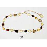 An Italian gold necklace set coloured semi-precious stones including citrines and smokey quartz,