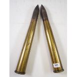 A pair of military trench art naval two pounder shells in brass casings, 45cm