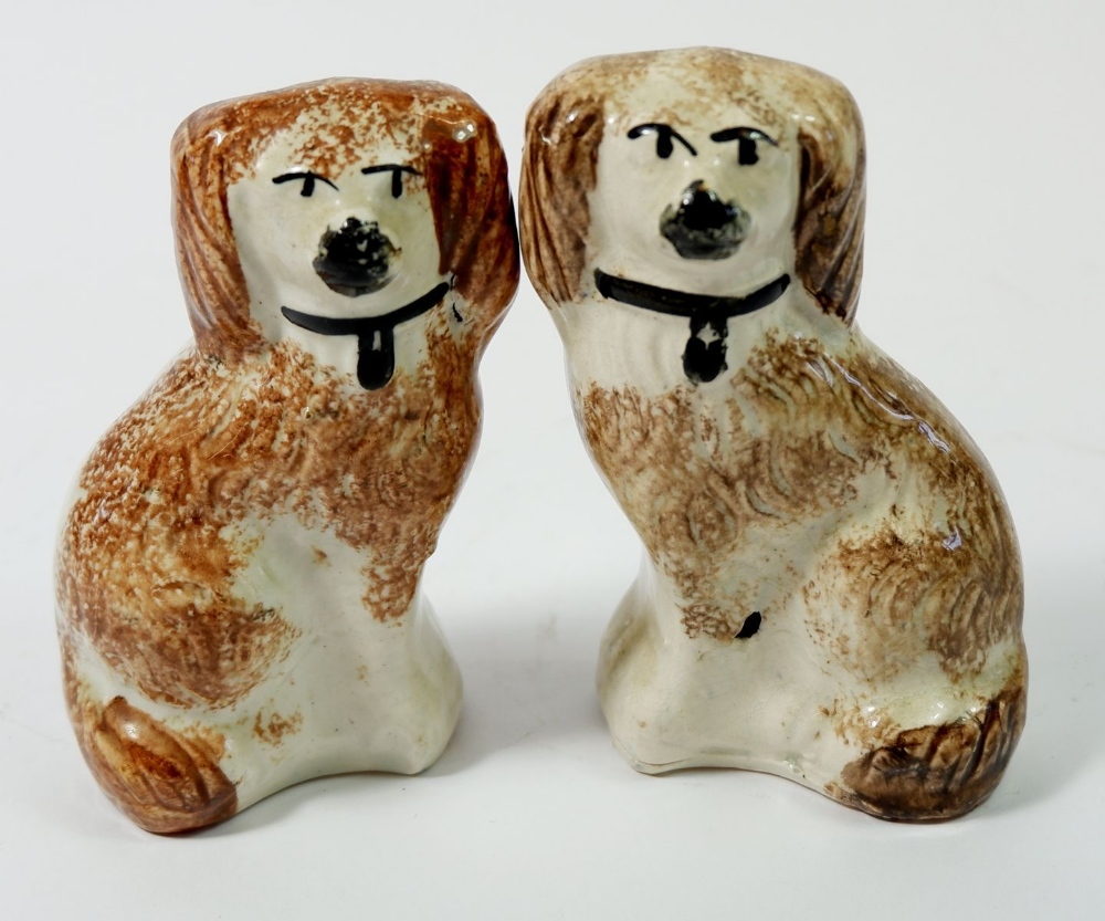 A pair of small Staffordshire brown sponged dogs, 12cm high
