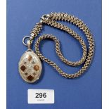 A Victorian silver oval locket with yellow metal inlay and silver fancy link chain, 47.5g