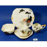 A Shelley Art Deco tea service 'Sunset & Flowers' comprising: twelve cups and saucers, twelve tea