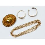 Four pieces of scrap 9 carat gold jewellery including two rings, a brooch and a chain, total