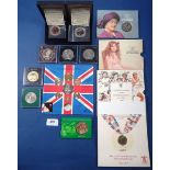 A miscellaneous lot of Royal Mint issues including: folders Commonwealth Games 1986 £2 coin, The