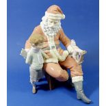 A Lladro figure 5971 'A Special Toy' Father Christmas with boy and toy, unboxed