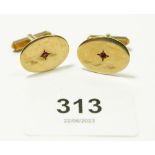 A pair of 9 carat gold cufflinks set red stones, 7.8g