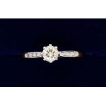 An 18 carat gold and platinum set solitaire diamond ring, size K, 1.9g