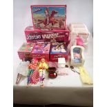 A collection of five Mattel Barbie doll sets including VW Golf Convertible, Dallas House, Makeup