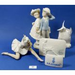 A collection of Lladro to include a ballerina, a boy and girl holding hands, a Lladro society