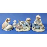 Four Lladro figures, 5451 'Study Buddy' 7672 Dog with flower pot, boy with a dog and 7685 'Friend