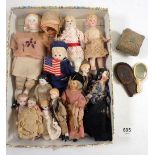 A collection of twelve small dolls mostly porcelain with some having articulated joints, largest