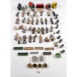 A collection of Britains lead farm figures, farm animal houses, milk churns and troughs