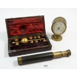 A Sikes hydrometer boxed, a Victorian oval aneroid barometer and a small telescope