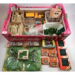 A box of Britains landscape items including tree models, fencing, milk churns, hedging, animal pens,