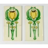 A pair of Art Nouveau ceramic tiles, 15 x 7.5cm - one a/f