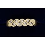 A 9 carat gold plaited ring set eight diamonds size N, 2.4g