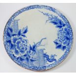 A Japanese blue and white charger with peony decoration, 46cm diameter