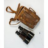 A pair of Hezzanith naval binoculars with leather case, with military mark and 'N'