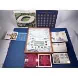 A miscellaneous lot of British coinage, medallions and banknotes including: Royal Mint folder issues