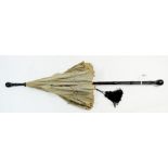 A Victorian silk parasol with ebonised handle