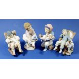 Four Lladro figures, 5488 Nap Time, 5846 All Tuckered Out, boy with kittens on a skateboard and 7620