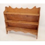 A 19th century pine bookcase consisting of three shelves, 117cm tall x 127.5cm wide x 27cm deep